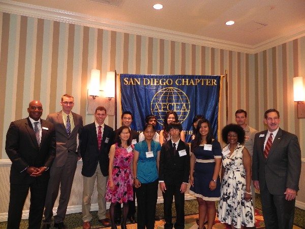 Benito Hobson (l), chapter president, and Jesse Hamilton (2nd from l), chapter vice president, join Pat Kelly (r), chapter vice president for education, and Adm. Becker (2nd from r), in congratulating scholarship recipients at the July awards presentation.